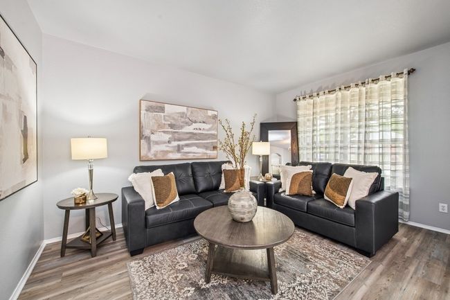 Living area with wood finished floors and baseboards | Image 7