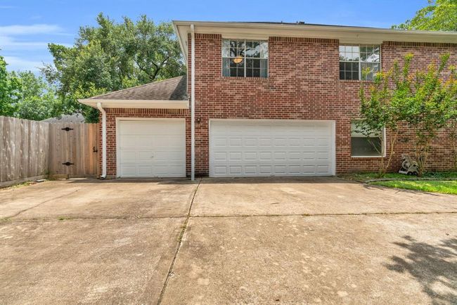 View of the 3 car garage from the side driveway. | Image 33