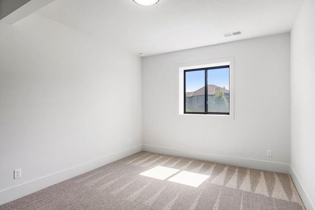 Empty room with light carpet and baseboards | Image 29