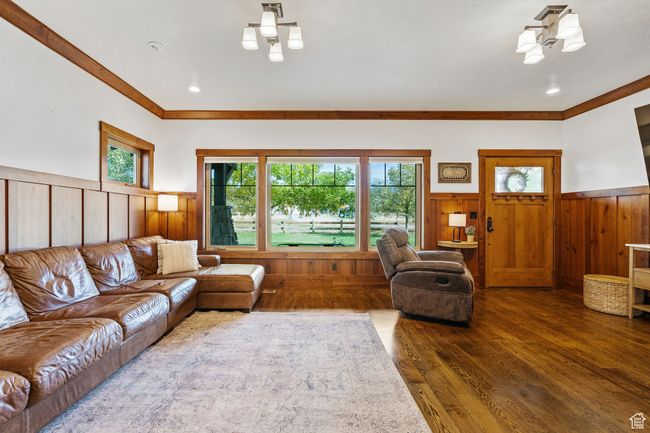 Living room with crown molding and dark hardwood / wood-style floors | Image 11