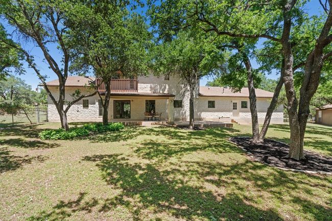 Back of property with a yard, fence, a patio area, and a balcony | Image 37