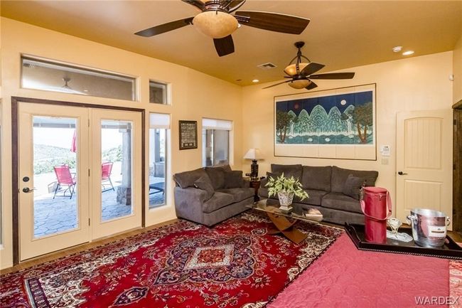 Living area with ceiling fan | Image 57
