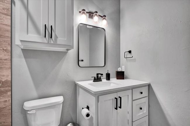Bathroom featuring vanity and toilet | Image 39