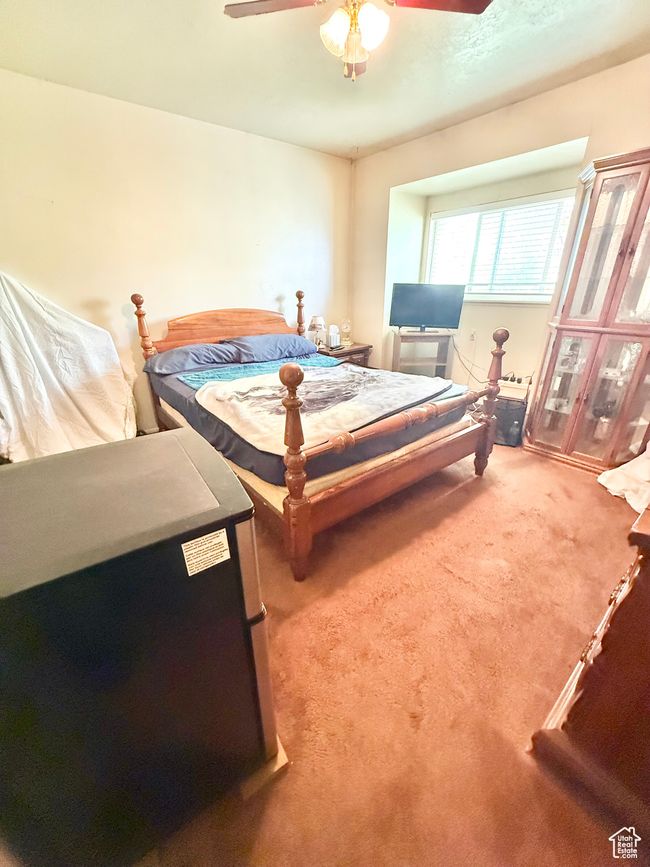 Carpeted bedroom with ceiling fan | Image 6