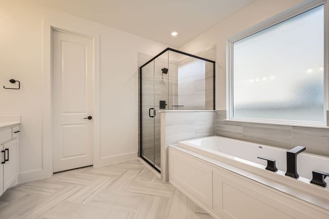 Full bath featuring a bath, a shower stall, vanity, and recessed lighting | Image 20