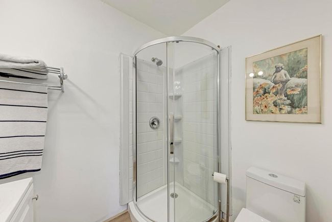 Full bath featuring toilet and a stall shower | Image 37