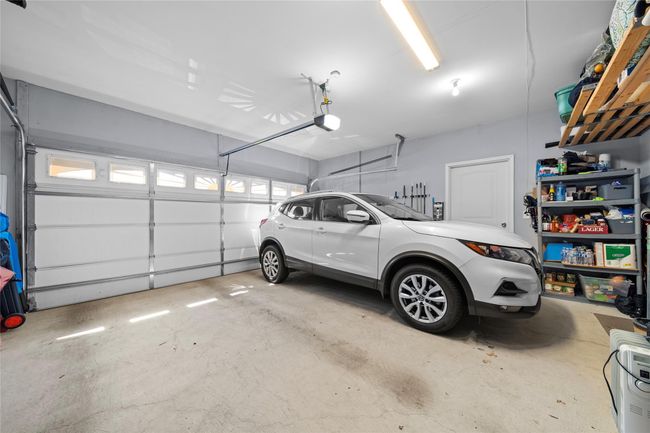 Garage featuring a garage door opener | Image 24