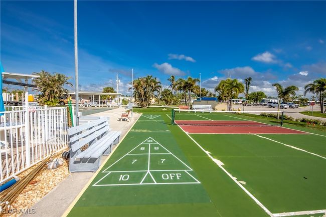 View of property's community with fence and shuffleboard | Image 5