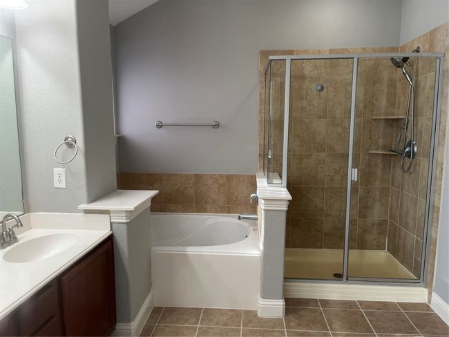 Full bath with vanity, a garden tub, a stall shower, and tile patterned flooring | Image 11