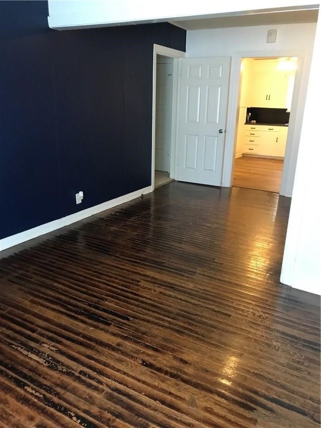 Spare room with dark wood-type flooring | Image 12