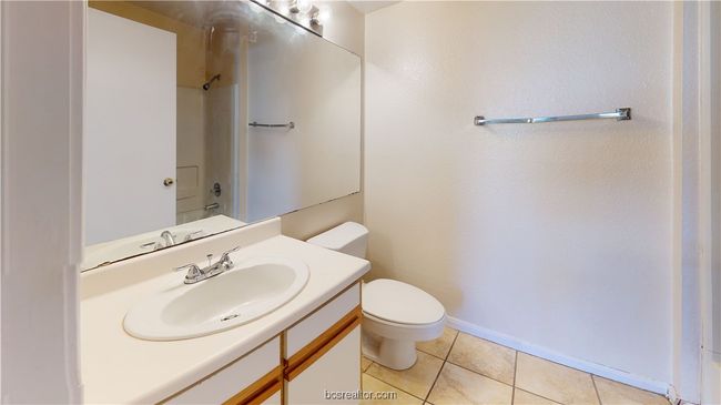 Bathroom with vanity, tile patterned floors, and toilet | Image 20