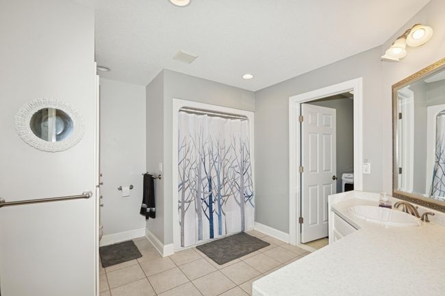 Main floor full bathroom with attached laundry room. | Image 31
