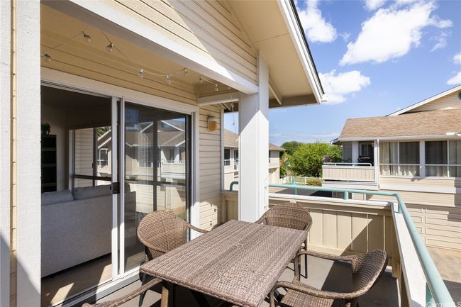 Oversized lanai with access through large sliders directly off the main living area. Great entertaining space, corner end unit! | Image 11