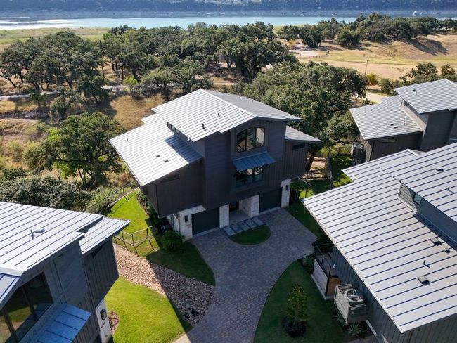 The Tree House community at the Reserve at Lake Travis is thoughtfully designed with a modern, nature-inspired aesthetic, blending seamlessly with the surrounding landscape to create a tranquil, design-forward living experience | Image 38