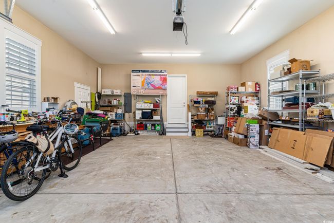 Garage featuring a workshop area | Image 32