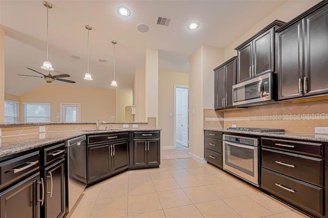 4914 Woodbury Mill Dr, House other with 4 bedrooms, 2 bathrooms and 2 parking in Spring TX | Image 6