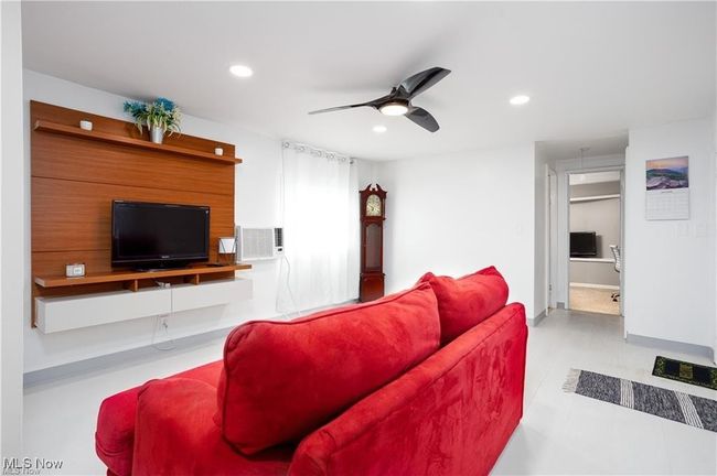 Living area with baseboards, recessed lighting, and ceiling fan | Image 5
