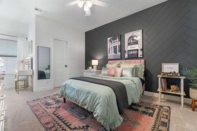 Bedroom with an accent wall, carpet, baseboards, and a ceiling fan | Image 33