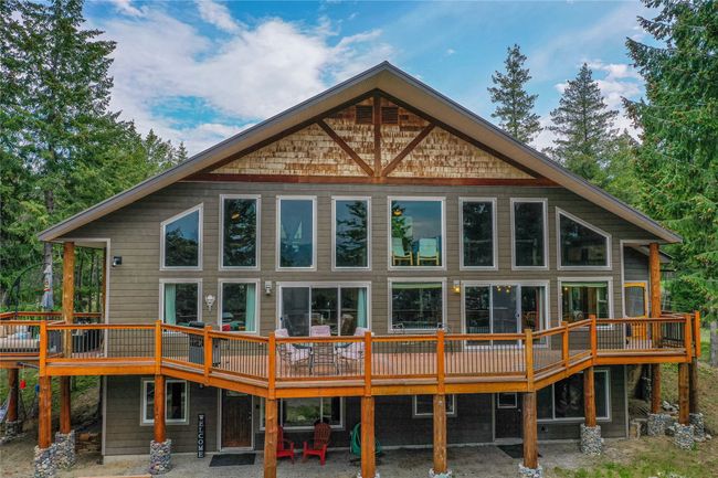 The massive windows and deck offer the ultimate in vacation living. | Image 18