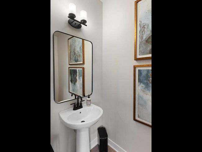 Elegant and functional, this stylish powder room features modern finishes and a sleek design, perfect for guests and everyday use. | Image 5