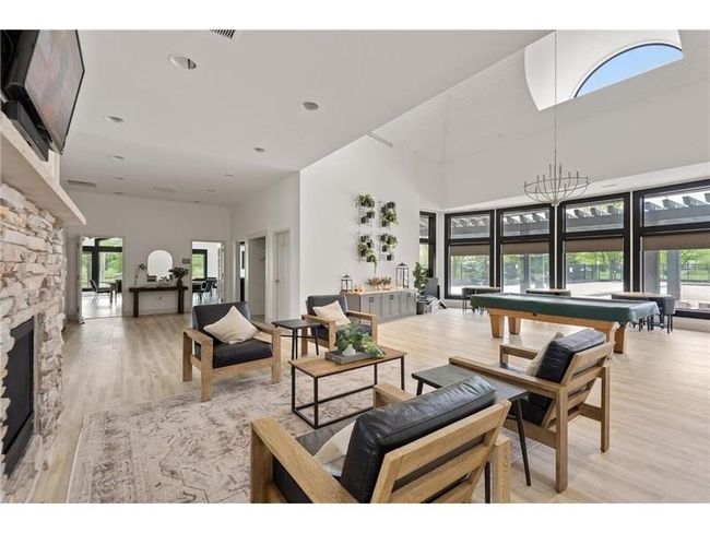 Your assoc fees include full access to the walkable and beautiful Waters Edge Community Center! pool, gym, and party room with kitchen! | Image 26