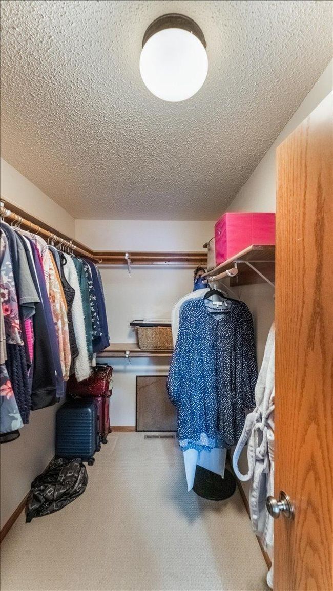 Large primary walk in closet | Image 12