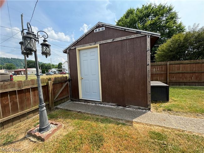 View of outdoor structure featuring a lawn | Image 29