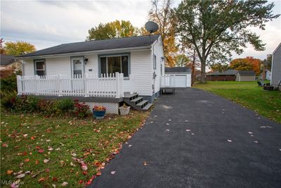 View of front of house featuring a 2.5 car detached garage and a front lawn | Image 2