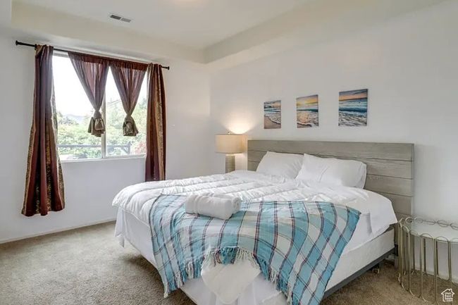 Carpeted bedroom featuring visible vents | Image 19