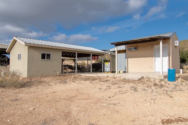 Rear view of property with a carport and an outdoor structure | Image 21