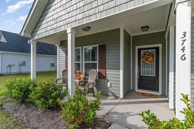 View of exterior entry with a porch | Image 2