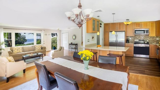 Dining area in open plan first level with view to living room and kitchen | Image 5
