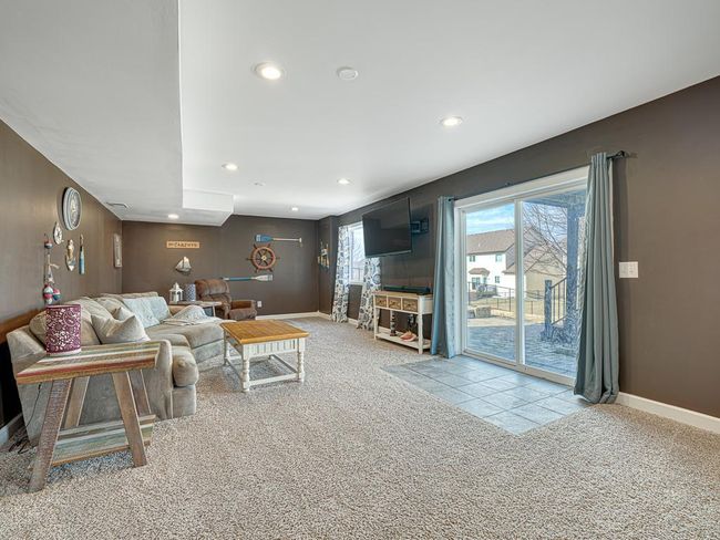 Finished walk-out basement with plenty of room for movie nights, toys, exercise equipment... whatever you want! | Image 6