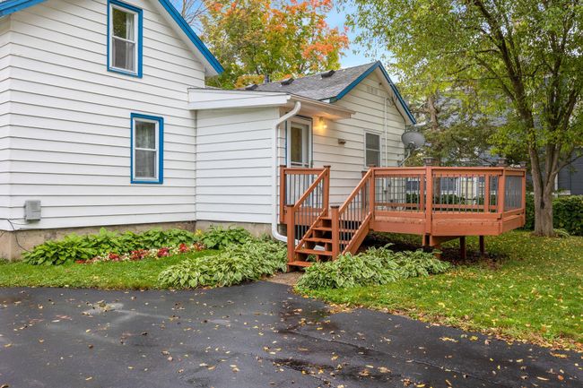 Back yard deck is newer and large enough for company. | Image 17