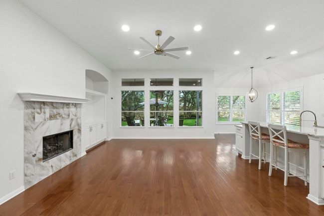 High ceilings, built-ins, gas fireplace, recessed lighting and plenty of natural light. | Image 10