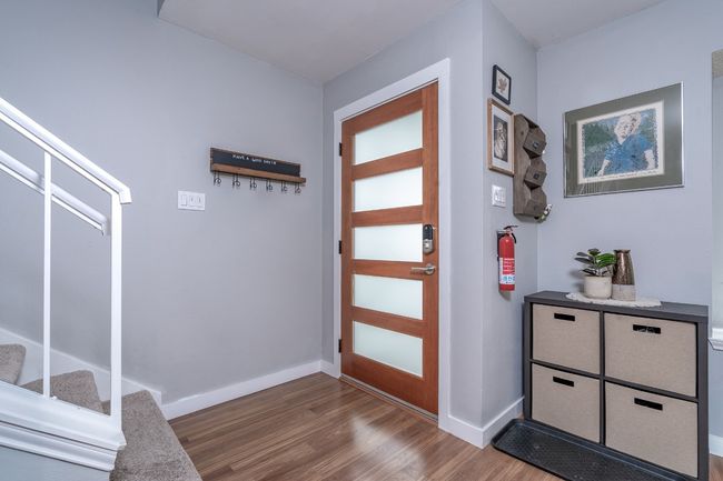 Entryway with wood finished floors and baseboards. | Image 6