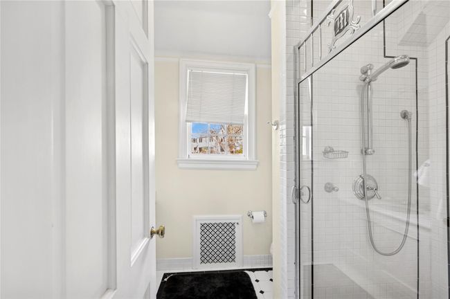 Fourth bedroom en-suite Bath with a shower | Image 30