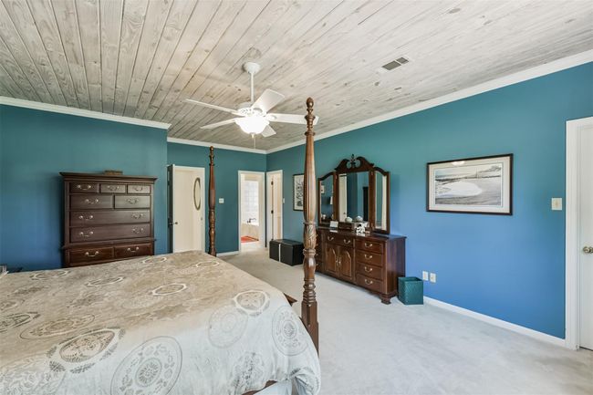 Expansive closet runs length of the bedroom and includes his-and-her doors. | Image 23