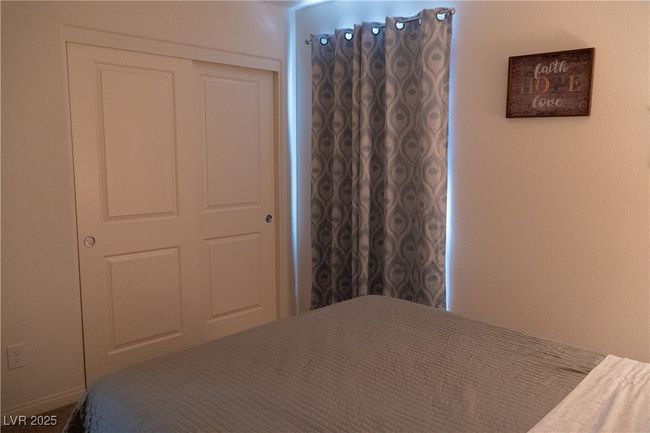 Bedroom with a closet | Image 61