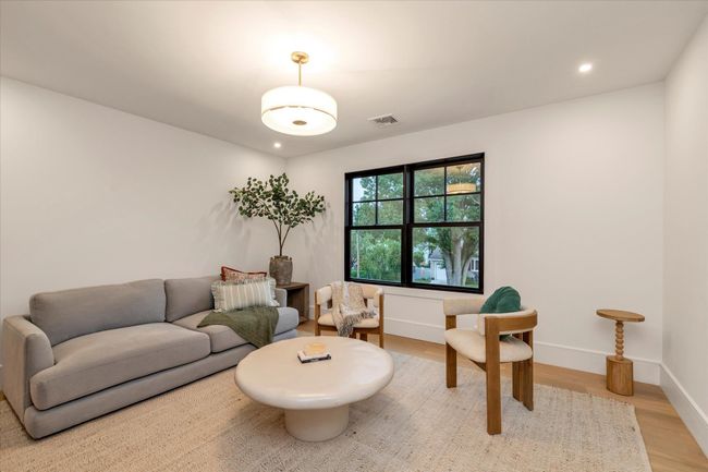 Living area featuring recessed lighting and light wood finished floors | Image 13