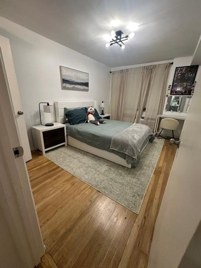 Bedroom featuring wood finished floors | Image 6