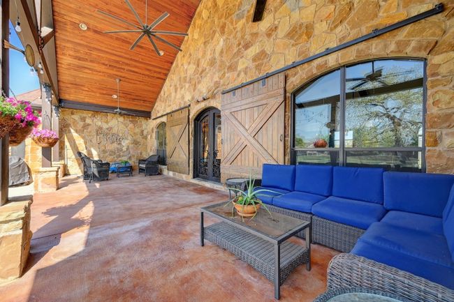 Wood tongue & groove ceiling, Wrought Iron doors - an amazing space to spend your days! | Image 37