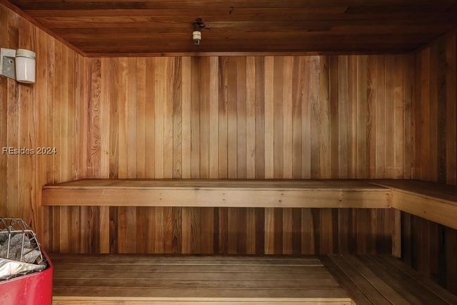 View of sauna featuring wooden walls and wooden ceiling | Image 23