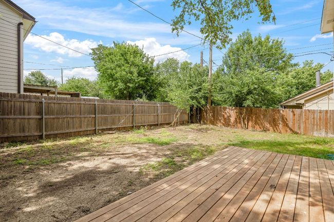 Wooden deck featuring a fenced backyard | Image 27