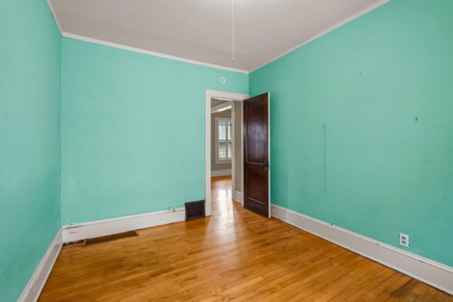 This third main-floor bedroom offers plenty of natural light, creating a bright and welcoming space. | Image 8