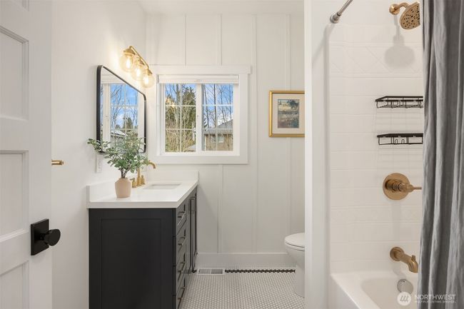 A recently remodeled full bathroom on the main level. | Image 18