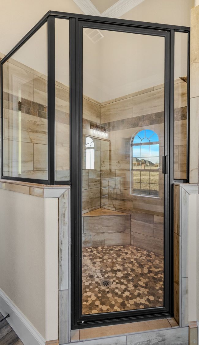 Bathroom with a stall shower, baseboards, and healthy amount of natural light | Image 17