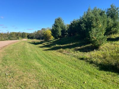 THE VIEW ALONG THE WEST LOT LINE. | Image 2