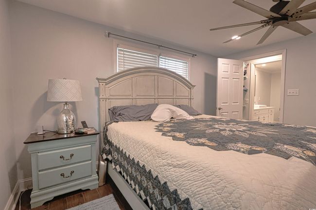 Bedroom with wood finished floors, ensuite bathroom, a ceiling fan, and recessed lighting | Image 17