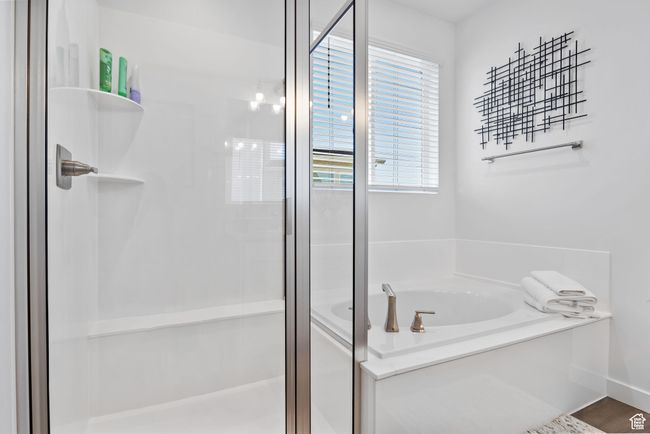 Bathroom with a stall shower and a bath | Image 20